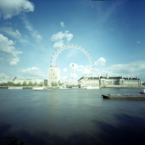 The London Eye is an enormous wheel on the south bank of the thames. With a 35mm camera it would easily fill the frame with a standard length lens. Using a pinhole camera though, it only fills 1/9th of the frame. To fill the frame the pinhole would need to be 2/3rds closer, in the middle of the river. A satisfactory shot is just not possible from this angle.