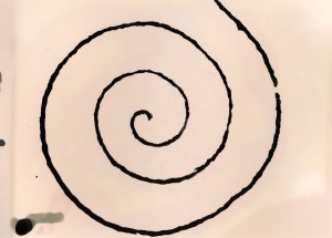 Print resulting from application of developer to the string spiral stamp.