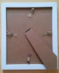 An 8x10" sized glass photo frame from a pound shop. The quick release clips allow easy changing of paper.
